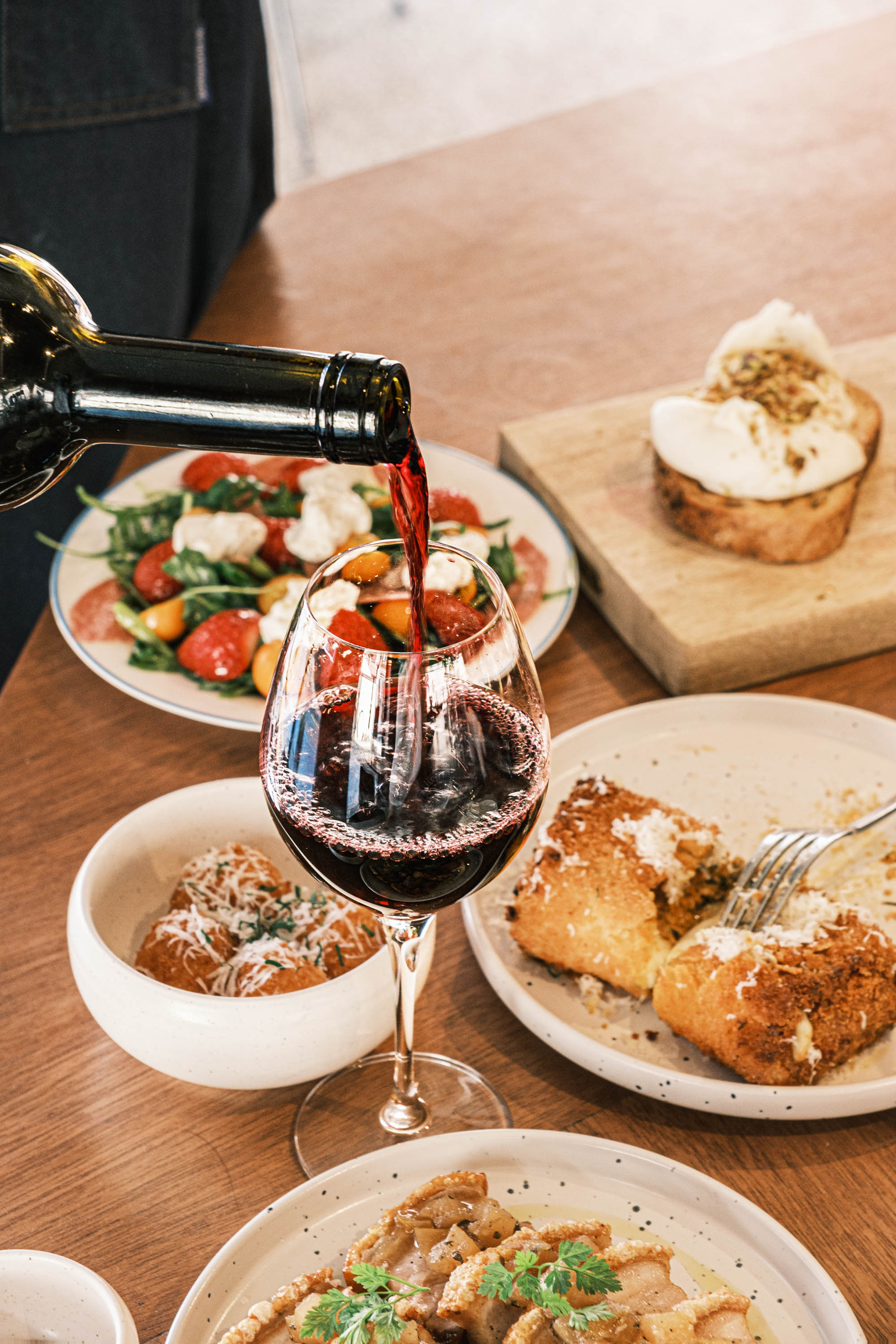 Arancini + Seasonal Fruit Arugula Salad + Handmade Jambon Pasta + Super Crispy Pork Belly + Premium Ice Cream + House Wine 1 Bottle