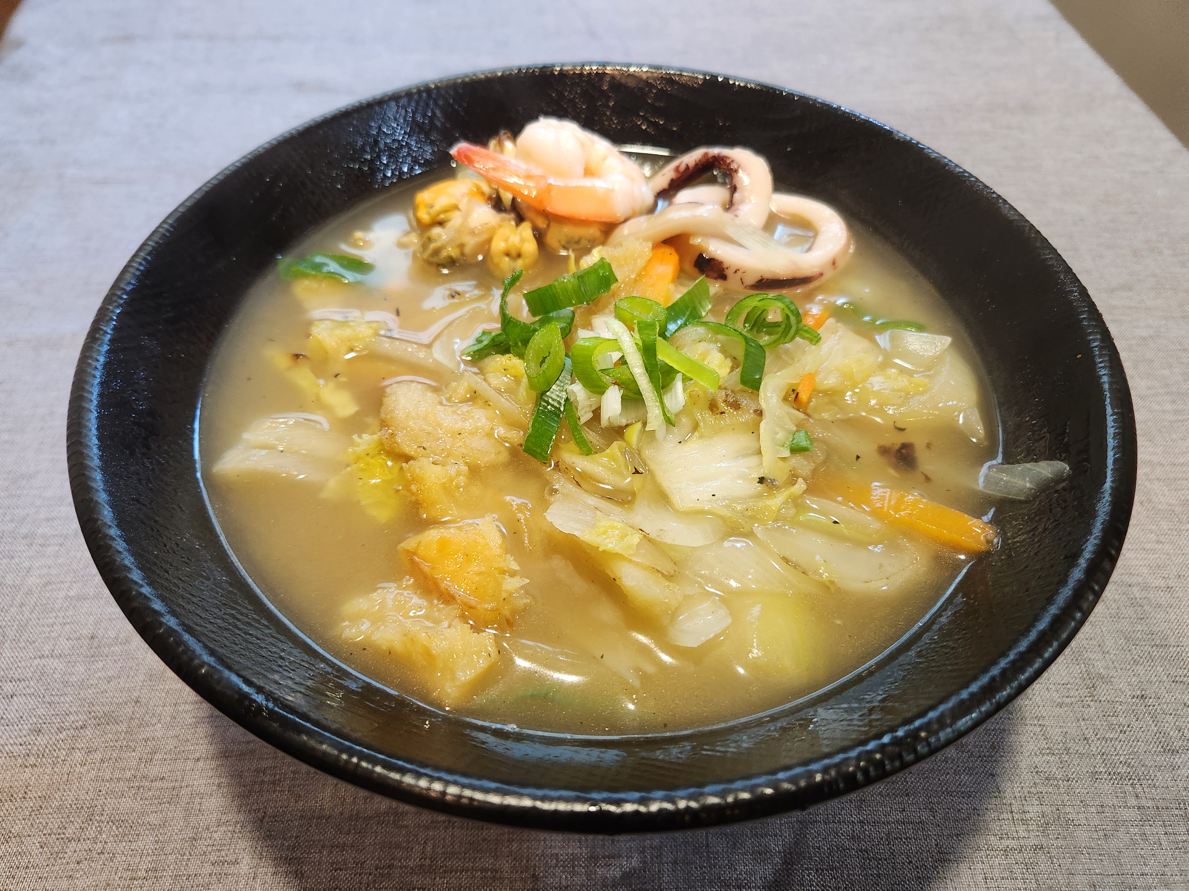 White Spicy Seafood Noodle Soup with Pollack