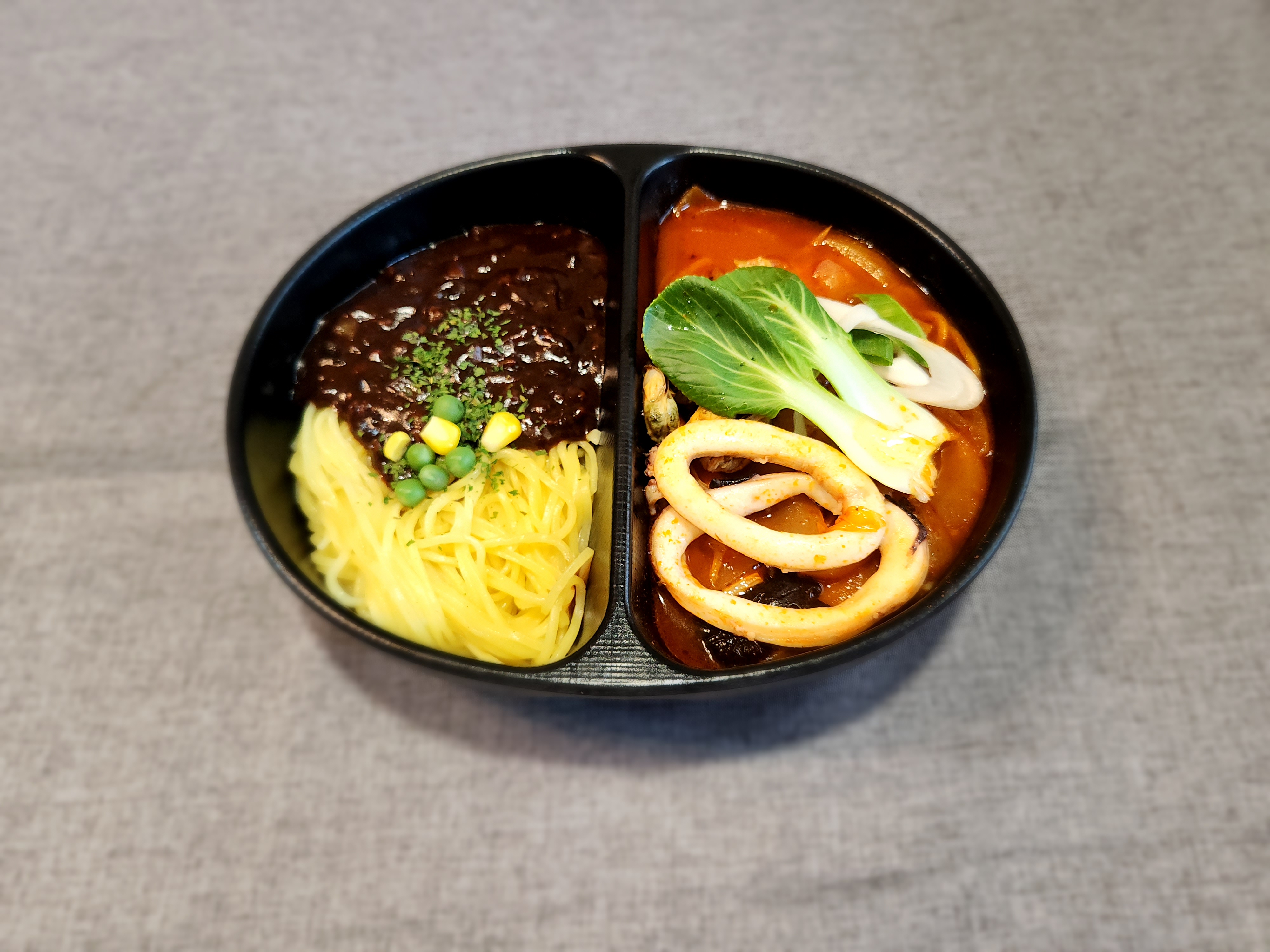 Half Spicy Seafood Noodle Soup and Half Black Bean Sauce Noodles